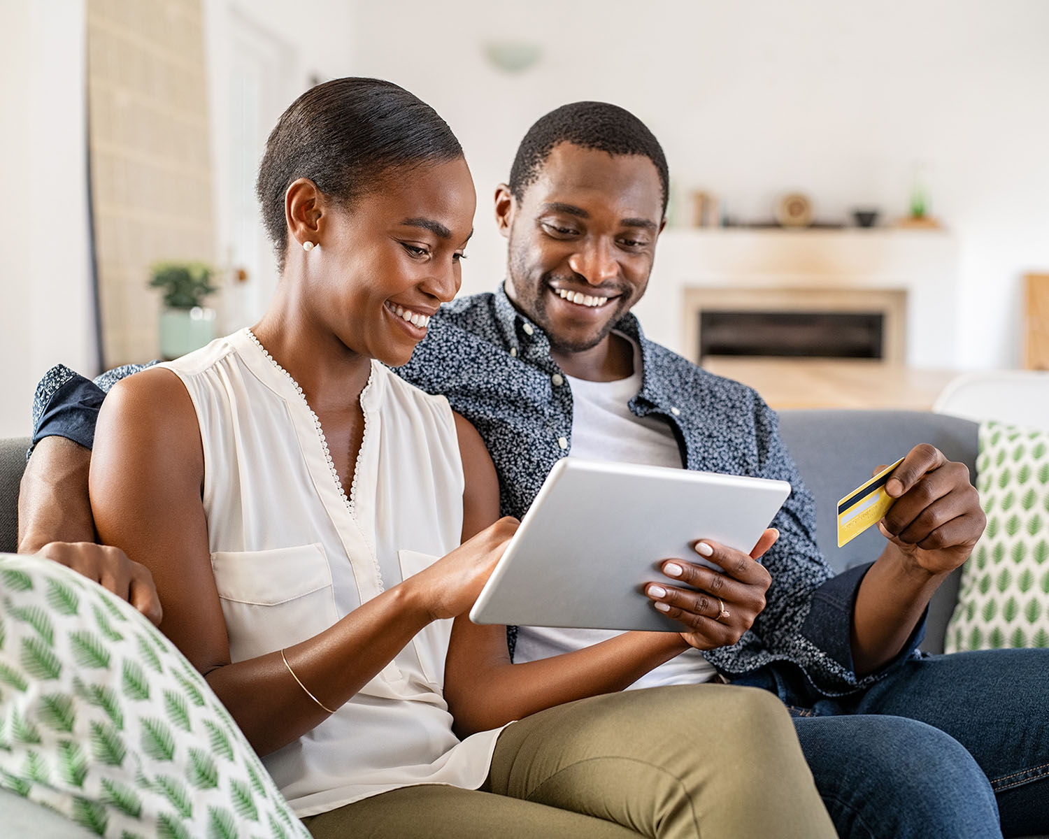 African American couple buying online with credit card