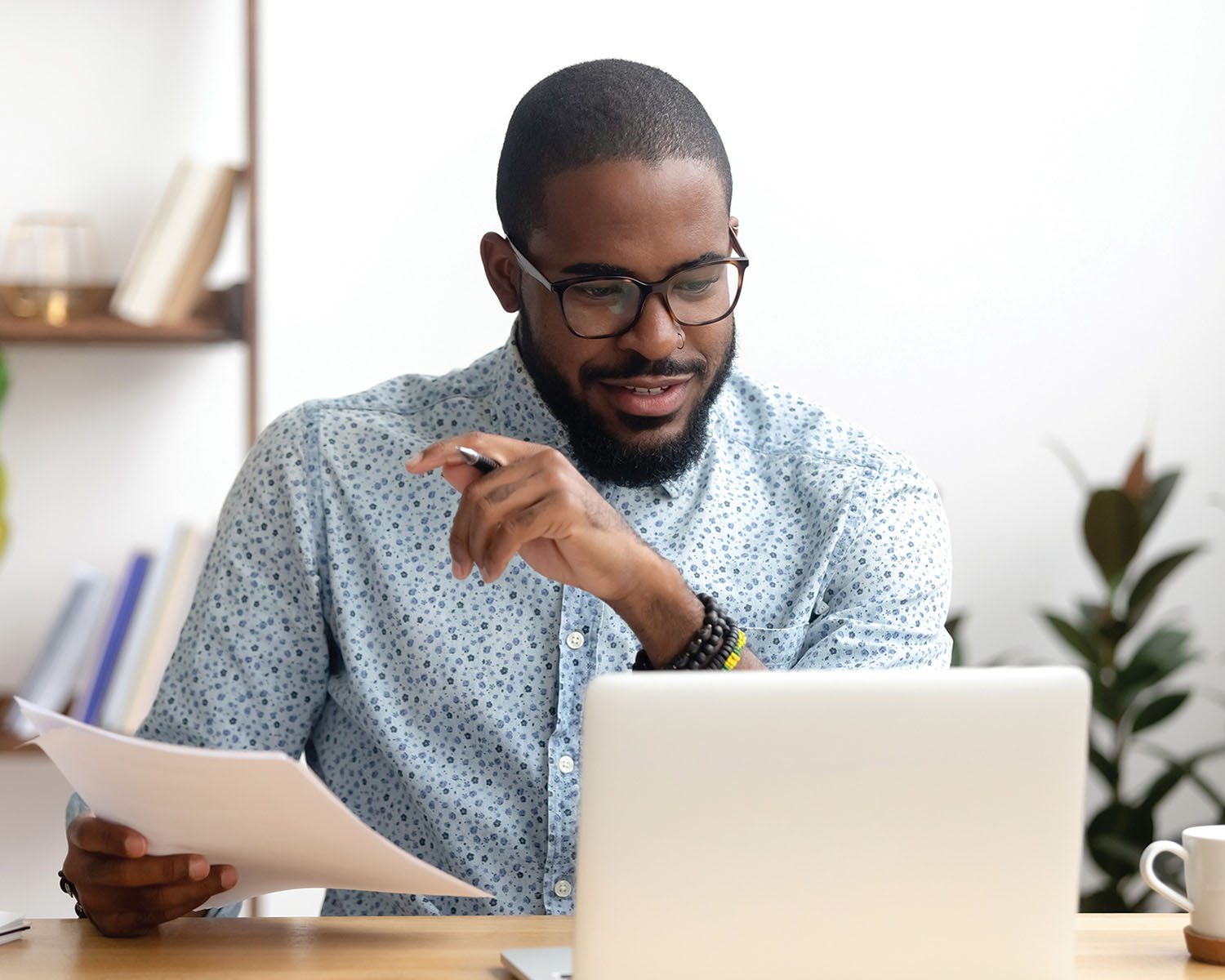 man paying bills online