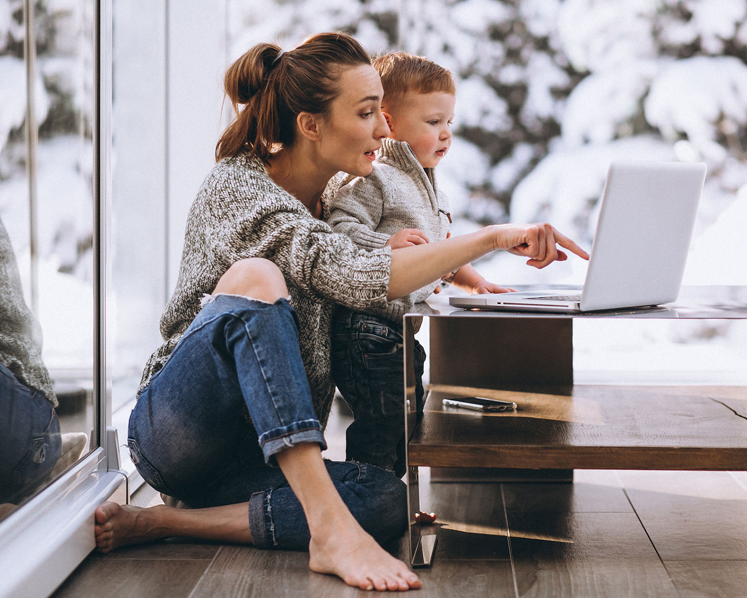 woman with child on a laptop