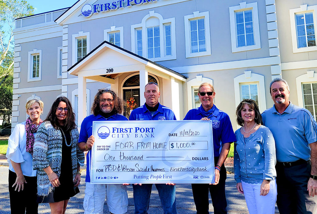 Foar From Home donation check presentation