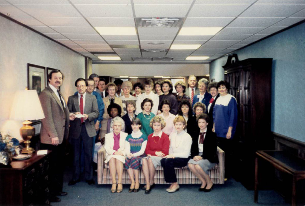 old photo of first port city bank employees from the 1970's